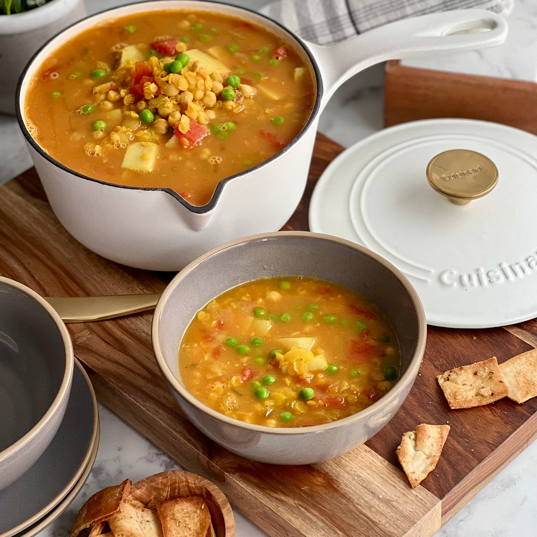 Curried Chickpeas Soup with Pita Croutons An easy steamy, Anglo-Indian satisfying soup of succulent chickpeas, red lentils, potatoes, and peas slowly simmered in a curry scented vegetable broth served with crunchy cumin pitta croutons is a gourmet's delight of full of exotic flavors.